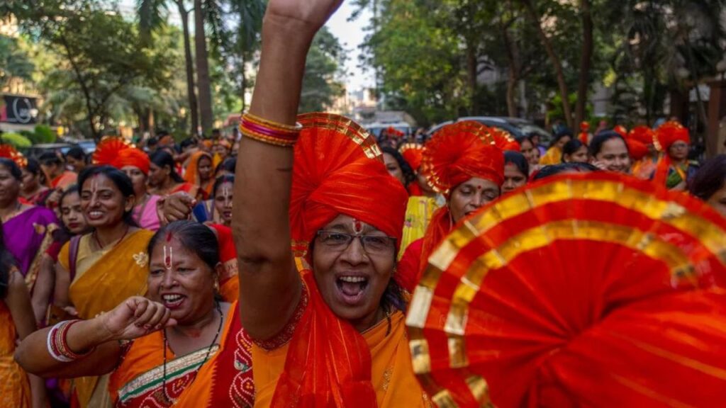 During a procession in Mumbai, India, on January 21, 2024, Hindu ladies sing holy slogans in celebration of the impending opening of a huge temple for the Lord Ram in the northern city of Ayodhya.