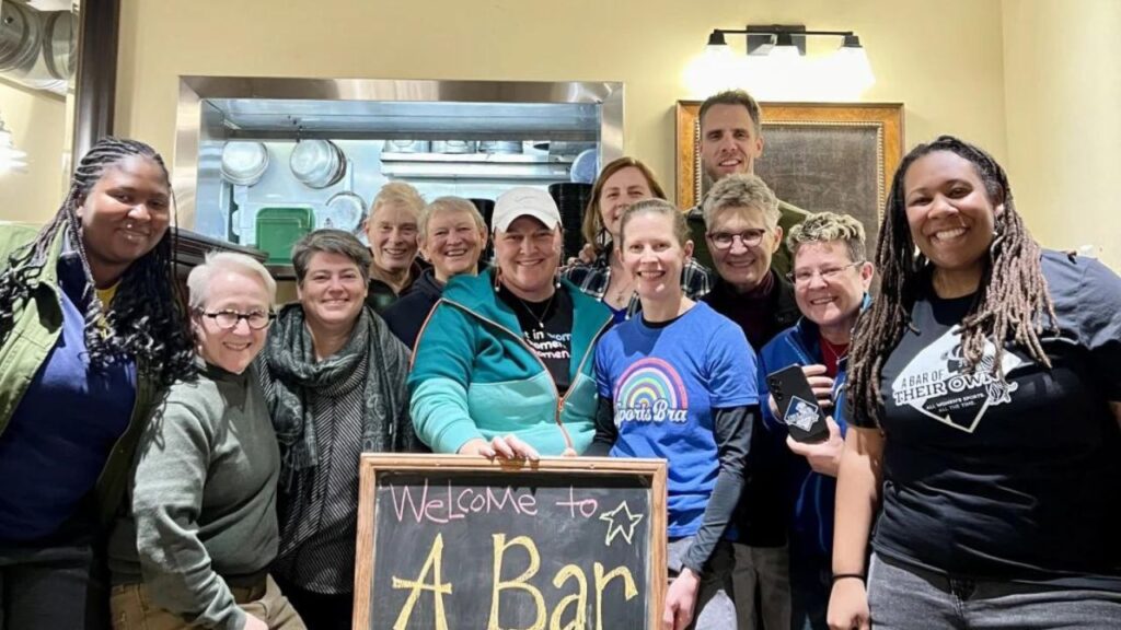 On December 1, 2023, the day the building's purchase was completed, Jillian Hiscock, the founder of A Bar of Their Own, is pictured in the center wearing a white hat with friends and family. The job advertising for A Bar of Their Own, a Minneapolis-based establishment that is anticipated to debut next month, drew an incredible amount of interest.