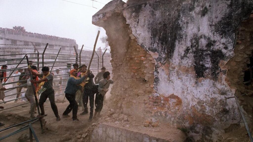 Hindu fundamentalists attack the wall of the 16th century Babri Masjid with iron rods at a disputed holy site in the city of Ayodhya in 1992.