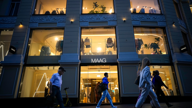 People walk past a newly opened Maag store, a former Zara flagship store, in Moscow, Russia, Monday, Aug. 21, 2023. The economy’s resilience in the face of bruising Western sanctions is a major factor behind President Vladimir Putin’s grip on power in Russia.