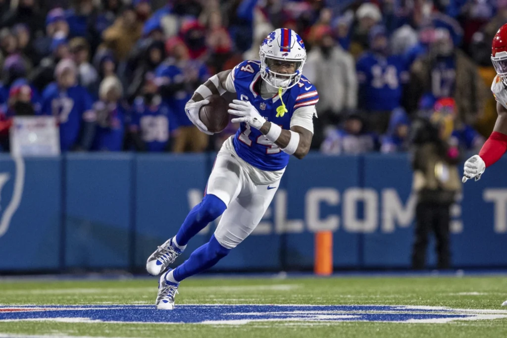 Buffalo bills wide receiver Stefon Diggs (14) runs after a catch during an NFL divisional round playoff football game, Jan 21, 2024 in Orchard Park , N.Y.