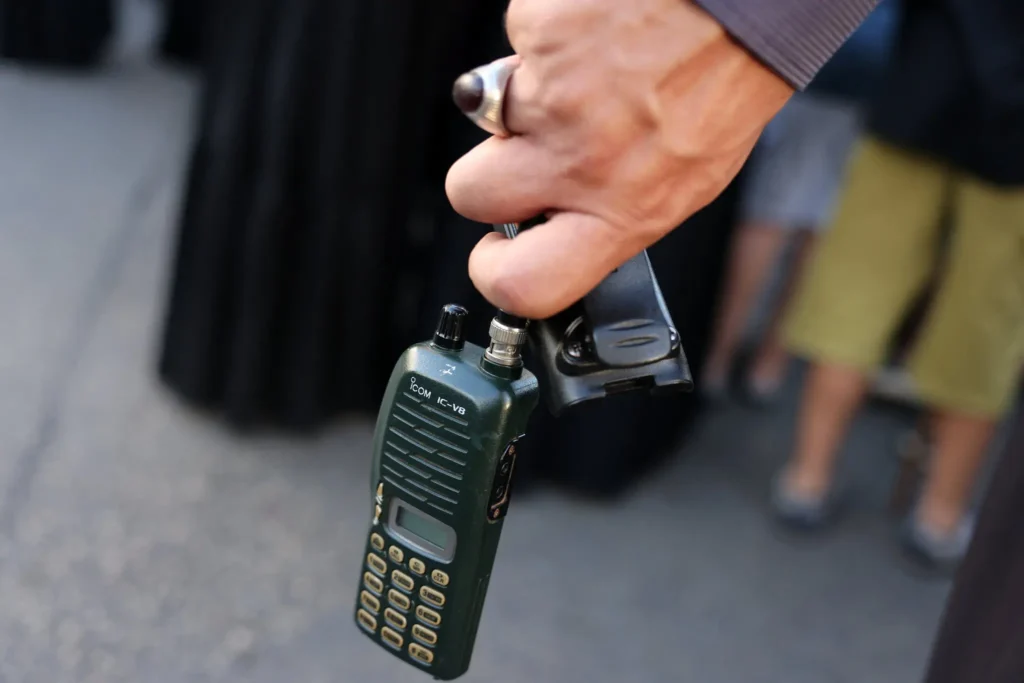 A portable radio with the battery removed during a funeral in Beirut, Lebanon, on Wednesday. The presumed Israeli sabotage of wireless devices used by Hezbollah turned ordinary communication devices into miniature grenades.